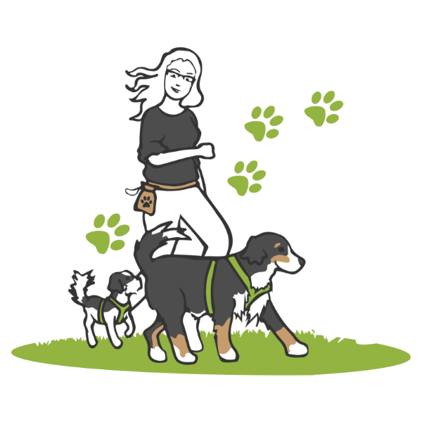 Hundetrainerin Nicole mit ihren Hunden im Feld